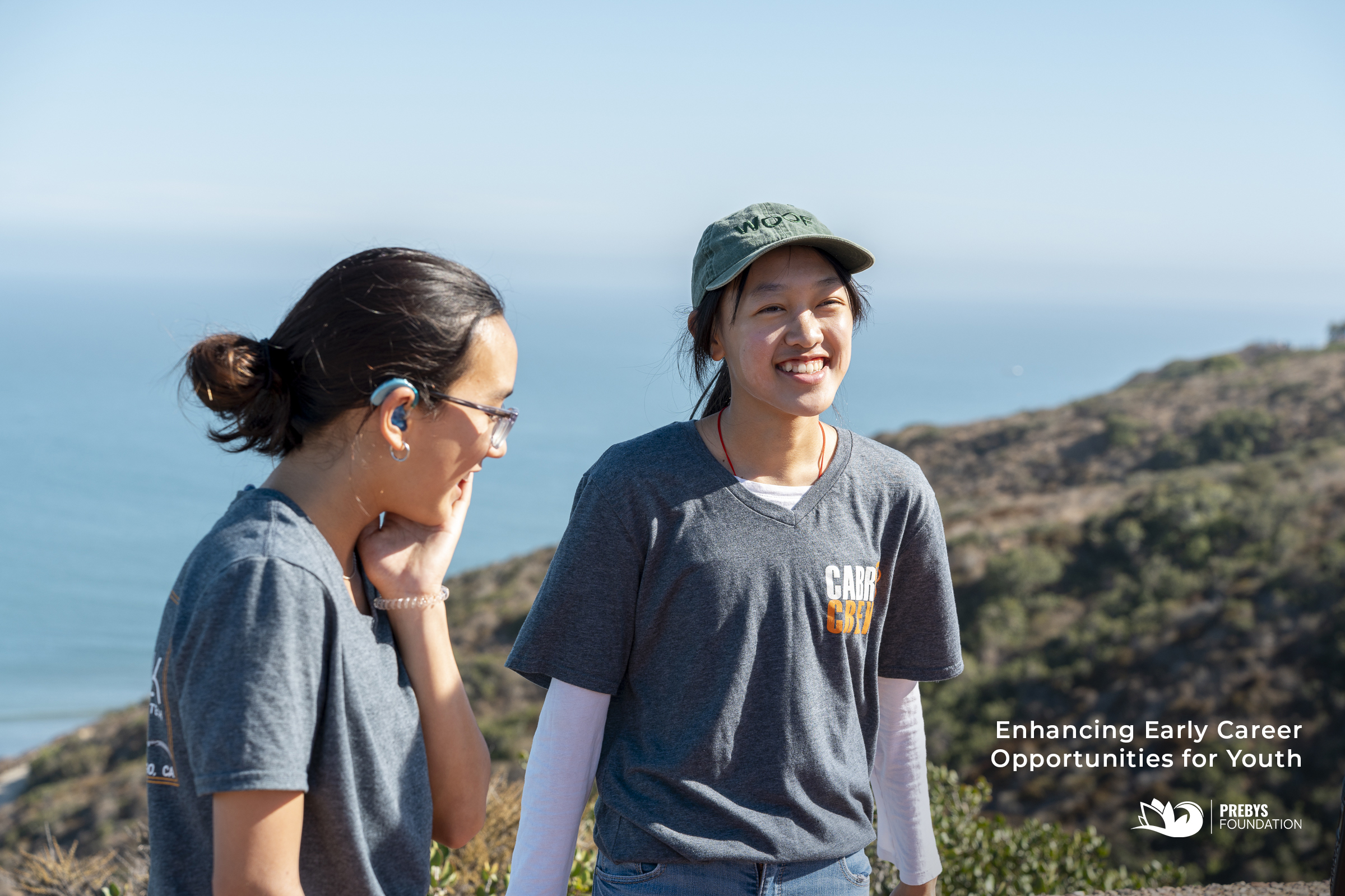 Two young people smiling on a hill at Cabrillo National Monument